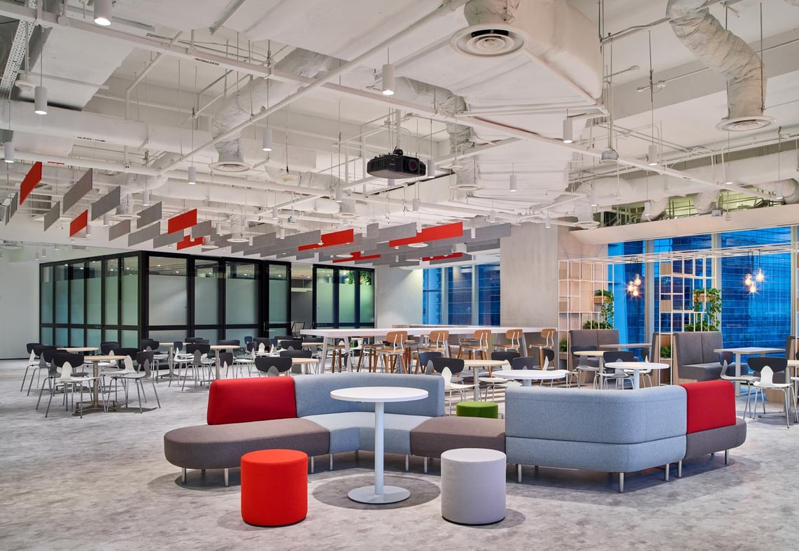 Spacious office with high ceilings, separated meeting room, seating and dining area.