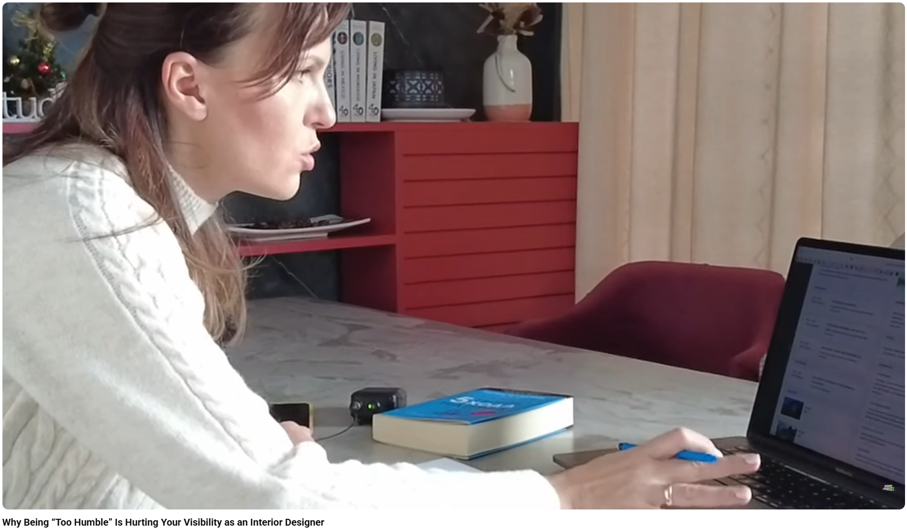 Interior designer working on a professional portfolio and project documentation